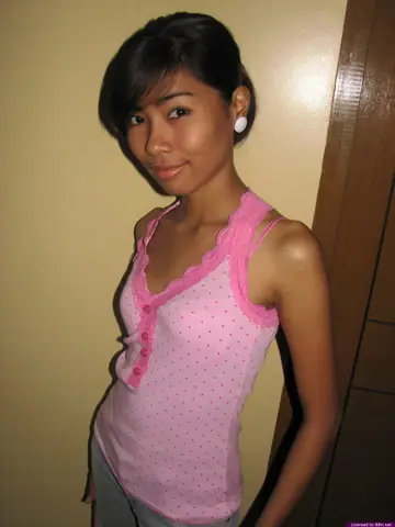 Skinny Asian Babe Strips Out of Her Jeans and Shows Her Shaved Pussy