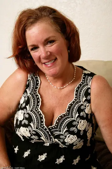 Curvy Mature Redhead Shows Her Feet While Undressing