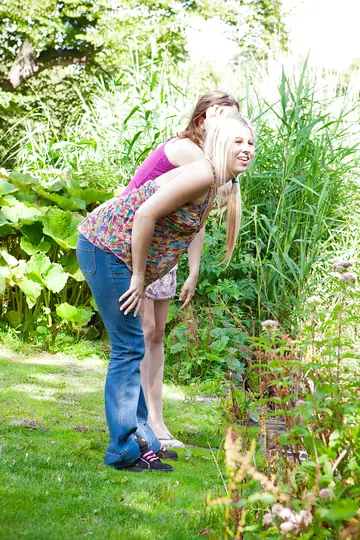 Two Women with Pierced Tongues Eat Hairy Pussy Outdoors