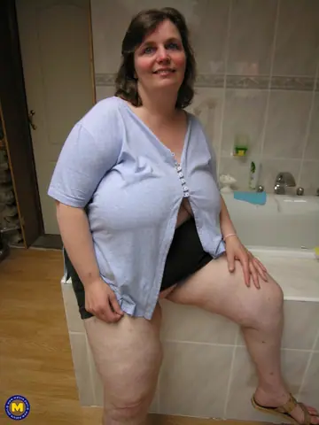 Curvy Mature Woman Strips in the Bedroom and Rides a Dildo in the Bathroom