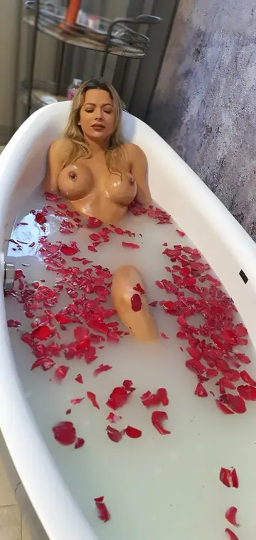 Shalina Divine – Slim Brunette MILF with Big Fake Tits Fucks a Dildo in the Bathroom