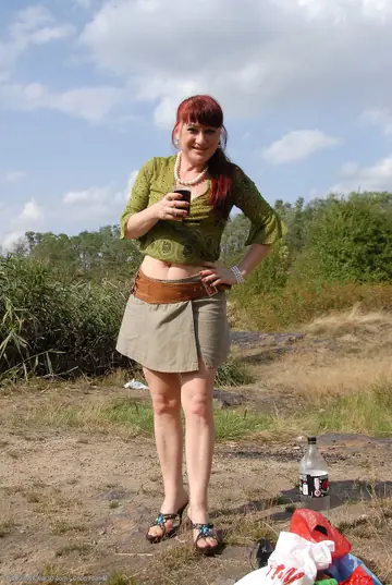 Busty Mature Redhead Spreads Her Legs Outdoors