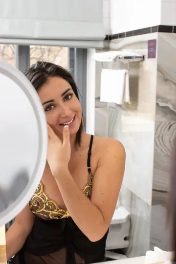 Petite Brunette in a Dress Undresses in the Bathroom