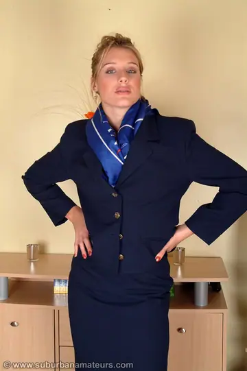 Tall British MILF Strips Off Her Uniform and Shows Her Hairy Bush
