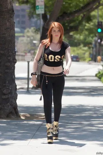 Lilith Lust – Petite Redhead in Yoga Pants and Heels Spreads Outdoors