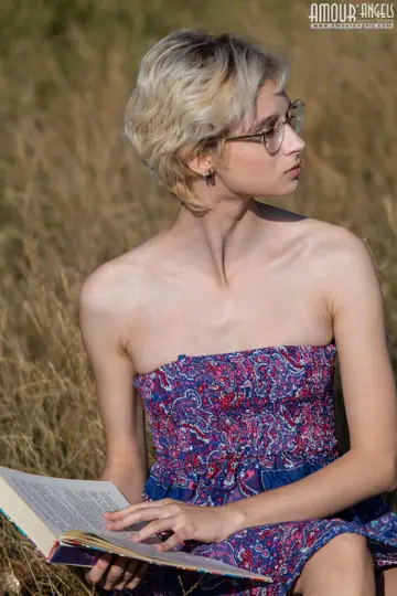Slim Blonde in Glasses Strips Naked and Spreads in the Forest