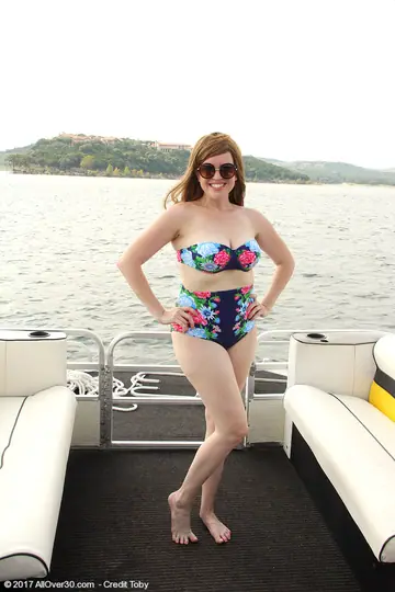 Holly Fuller – BBW Redhead in a Bikini and Glasses Flaunts Her Curves on a Boat
