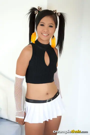 Skinny Thai Brunette Lifts Her Skirt and Spreads Her Shaved Pussy