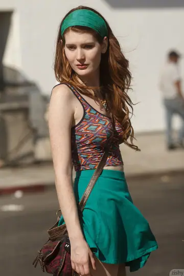 Redhead in a Skirt Over Jeans Flashes Her Panties Outdoors