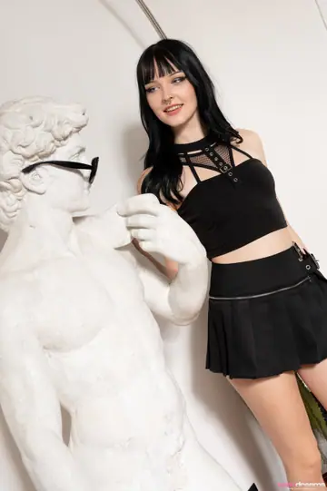 Amelia Riven – Brunette PAWG in Glasses Strips and Poses Nude with a Statue