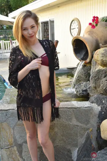 Petite Blonde in a Bikini Spreads Her Shaved Pussy and Pisses Outdoors