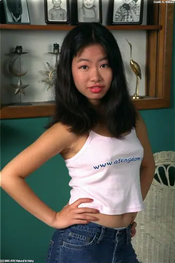 Asian Woman Removes Her White Panties and Spreads Her Hairy Pussy in Heels