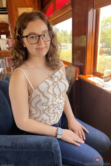 Leana Lovings – Petite Curly Brunette in a Dress and Glasses Spreads Her Shaved Pussy