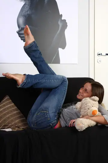 Brunette in Jeans Strips and Shows Her Shaved Pussy
