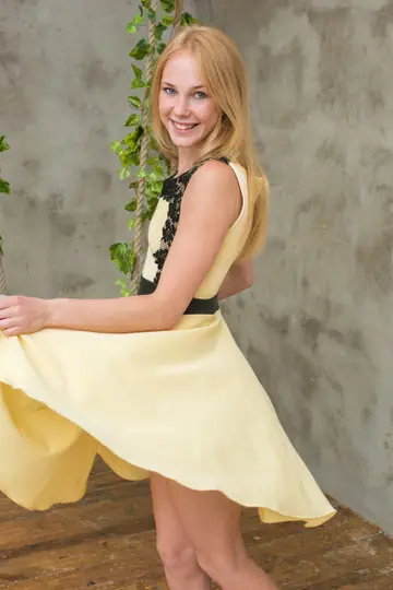 Petite Blonde Strips Out of Her Skirt on a Swing
