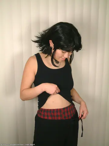 Mature Asian Woman in Shorts Spreads Her Hairy Pussy