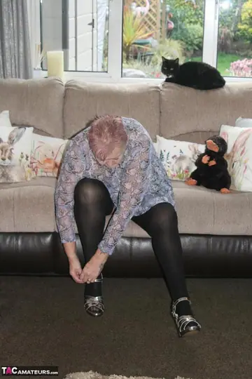 Tattooed Redhead BBW in Stockings and Heels Shows Off Her Heavy Curves