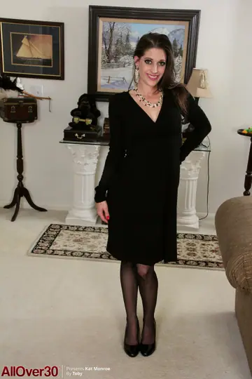 Genevieve Sweets – Mature Brunette MILF in a Dress and Stockings Spreads Her Shaved Pussy