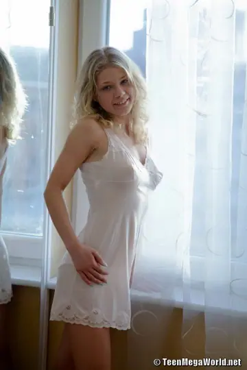 Valya – Thick European MILF Strips Out of Her Lingerie by the Window