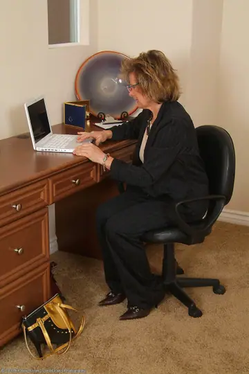 Short-Haired MILF Bares Her Saggy Tits and Hairy Pussy