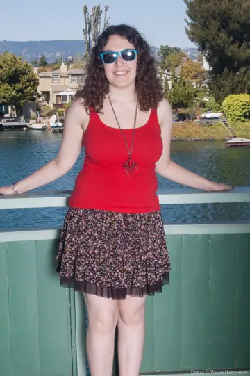 Chubby Curly Brunette in a Bikini Strips and Spreads Outdoors