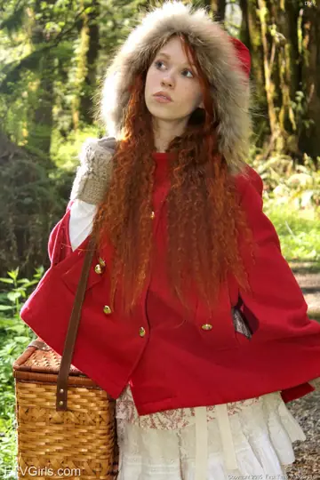 Petite Redhead Fingers Her Pussy with a Banana in the Forest