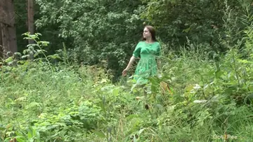 European Brunette Lifts Her Skirt to Pee in the Forest