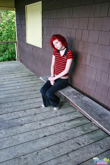 Slim Redhead Lifts Her Top and Drops Her Jeans on the Porch