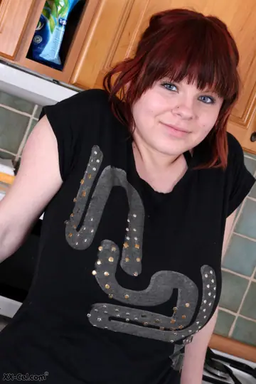 Chubby Redhead Amateur Strips Off Her Skirt and Panties in the Kitchen