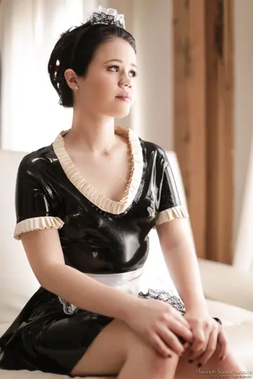 Yhivi – French Brunette in Latex Maid Uniform Strips by the Window