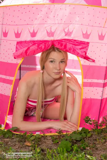 Skinny Blonde in Pigtails Spreads in a Tent