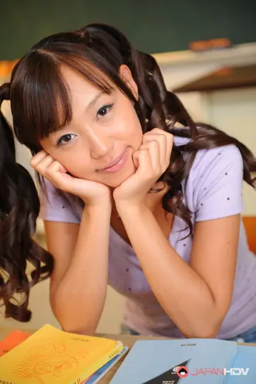 Japanese Brunette in Pigtails Poses in a Skirt and Lifts Hem
