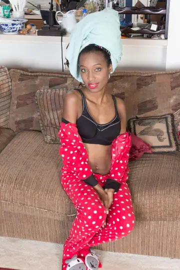 Skinny Ebony Babe with Short Hair Poses Nude in the Bathroom