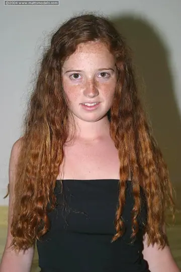 Thick Redhead Strips Out of Her Lingerie on the Bed