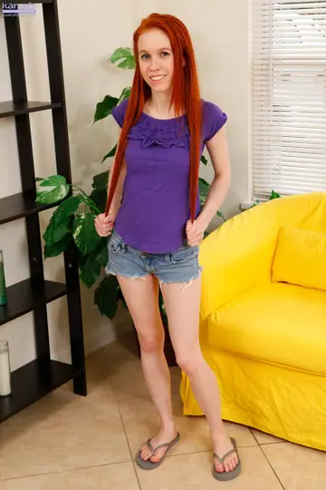 Redhead in Shorts Fingers Her Pussy