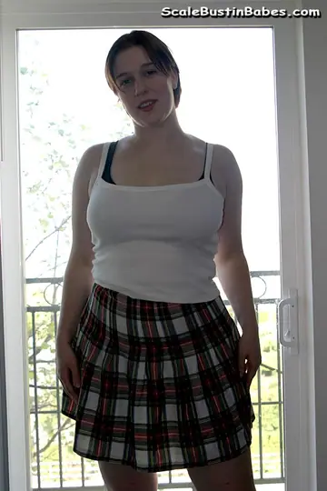 Curvy Redhead Undresses and Spreads Her Hairy Pussy