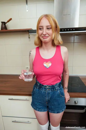 Emma Korti – Redhead in Stockings and Shorts Rides Him to a Facial
