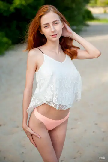 Helga Grey – Slim European Redhead Flashes Her Big Natural Tits on the Beach