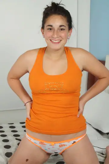 Petite Latina Undresses to Reveal Her Big Ass and Hairy Pussy