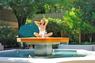 Woman Masturbates with a Hairbrush Outdoors