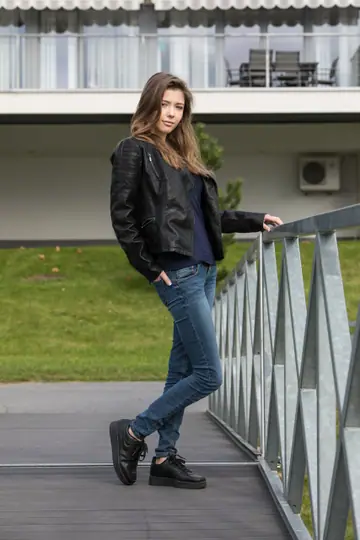 Busty Brunette Strips Out of Her Jeans Outdoors