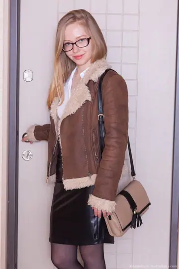 Slim Blonde in Glasses Strips Out of Her Skirt in Stockings