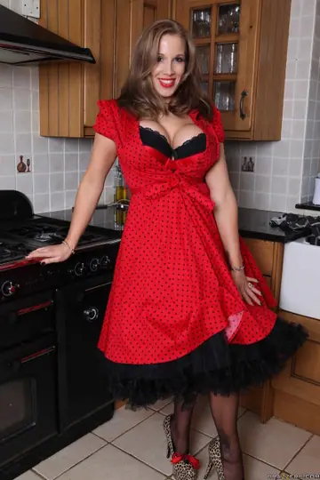 Rebecca More – Tall Blonde with Big Tits Strips to Lingerie and Poses in the Kitchen