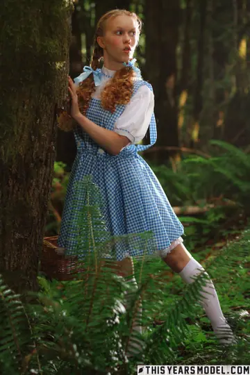 Pale Redhead in Cosplay Strips Out of Her Skirt and Socks in the Forest