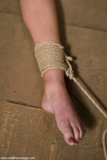 Wenona – Tall Brunette Bound in Bondage Restraints While Nude
