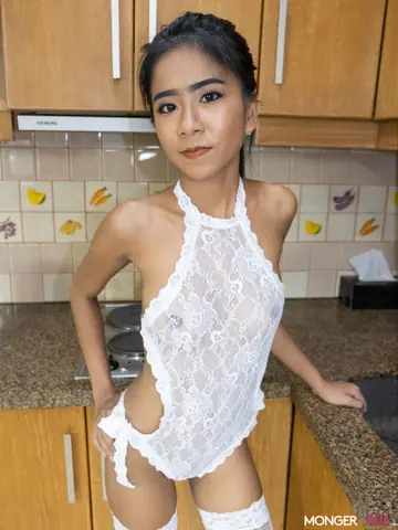 Thai Woman in Stockings Spreads Her Shaved Pussy