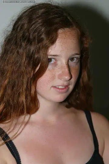 Redhead in Lingerie Spreads Her Hairy Pussy