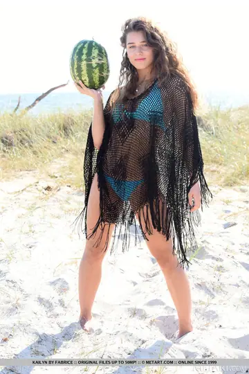 Brunette Strips Off Her Bikini and Spreads Her Shaved Pussy on the Beach