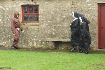 Claire Knight – Two British MILF Nuns Share a Friar Outdoors