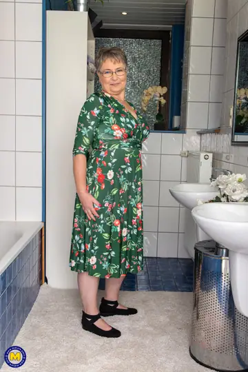 Mature European Woman Strips in the Bathroom